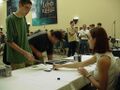 Shannon Baksa signing, with a Lord of the Rings TCG poster behind the table (6 October)