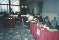 Staff tables with ocean view through arched windows